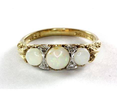 A 9ct yellow gold antique three opal and diamond set ring (K).