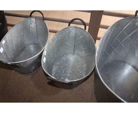 A metal oval planter (35)