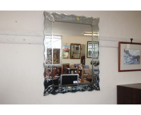 A Venetian style etched glass mirror