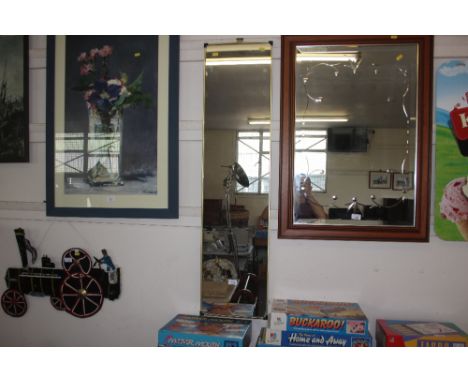 A brass framed oblong mirror