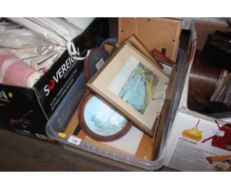 A box of various pictures and prints