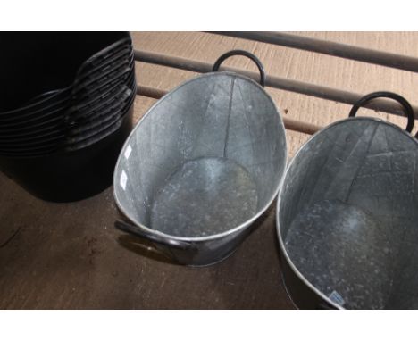 A metal oval planter (34)