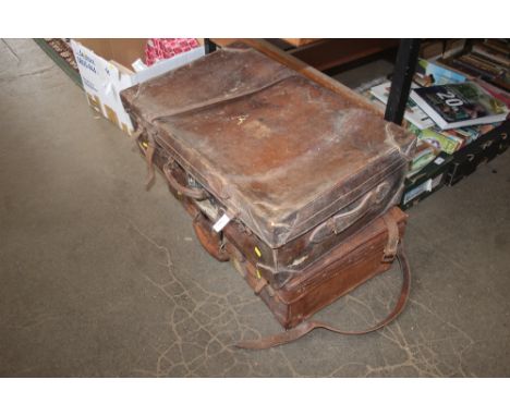 Two vintage leather suitcases