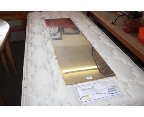 A brass framed oblong mirror