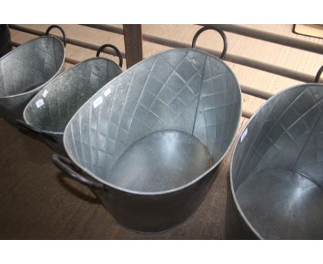 A metal oval planter (36)