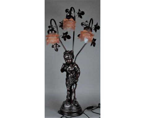 A three-light table lamp with glass roses and an image of a young girl picking flowers. Signed "Vilanis".H.: 83 cm. 