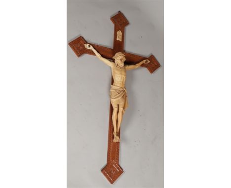 A large wooden crucifix. First half 20th century.H.: 135 cm. 