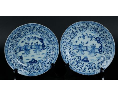 Two porcelain plates with tulip-shaped beds, outer rim with floral decor, the center with two frames with fence decor. China,