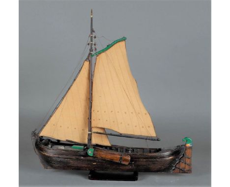 A ship model of a tjalk, first half of the 20th century.H.: 43 cm. 