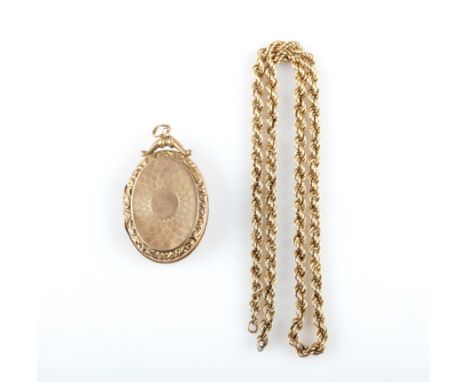 A hallmarked 9ct yellow gold locket with engraved detailing on the front and back, together with a yellow metal rope twist ch