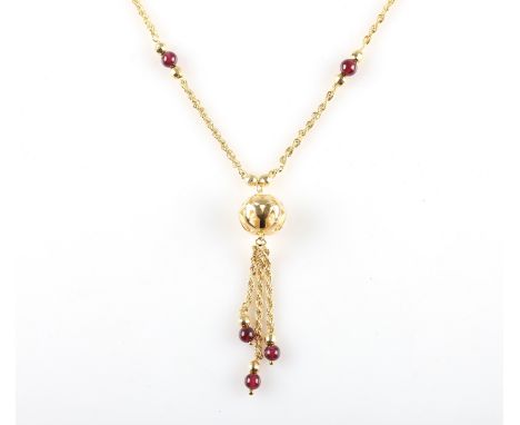 A hallmarked 9ct yellow gold rope chain suspending open metalwork pendant with garnet droppers.