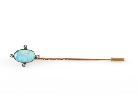 An opal and diamond stick pin, set with a central oval opal cabochon, measuring approx. 12x8mm, and four round cut diamonds s