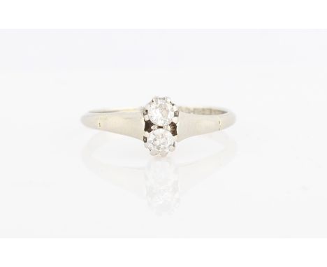 A toi et moi diamond ring, set with two old cut diamonds one above the other, total diamond weight approx. 0.20ct, stamped 18