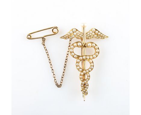A late 19th / early 20th Century caduceus seed pearl set brooch, the open metalwork design set with variously sized seed pear