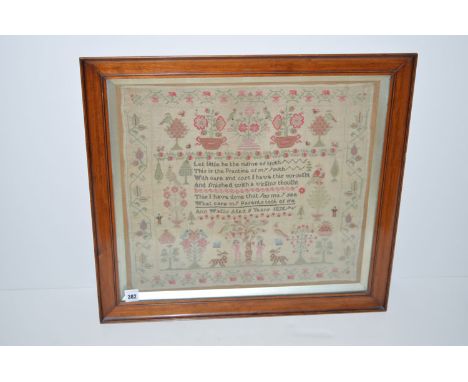 A Victorian needlework sampler, religious verse, the Garden of Eden, other animal, figural and floral decoration, stylized bo