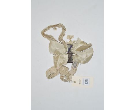 A pair of Edwardian cream silk garters, with white metal and enamel gate design badges, ''Private Road'' and ''No Thoroughfar