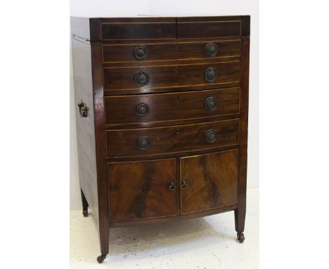 A fine quality George III mahogany and boxwood strung gentleman's washstand in the style of Gillows, the hinged divided top o