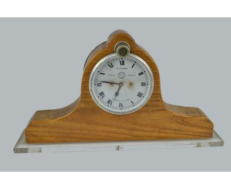 Automobile Interest - A Jaegar Paris 8 jours car clock, mounted in oak in a Napoleon's hat from case on a lucite plinth base,