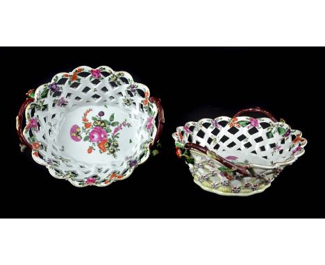 A pair of Worcester porcelain polychrome painted two handle baskets, c1770, oval with openwork trellis sides with florets at 