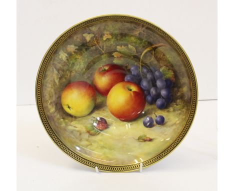 A Royal Worcester porcelain pedestal bowl, signed R.Sebright, painted with apples and grapes against a mossy bank, within a b