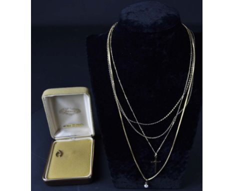 Three 9ct yellow gold chains, a small cultured pearl pendant; a cross pendant; and a horse shoe pendant, total weight 10grs (