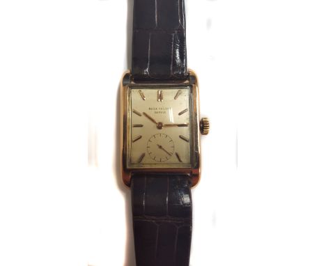 A rare gentleman's 18K solid rose gold Patek Philippe rectangular wrist watch dated 1950, ref. 2434 with Patek Philippe extra