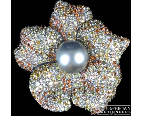 An impressive Southsea cultured pearl, diamond, coloured diamond and multi coloured sapphire flower brooch, the five petal fl