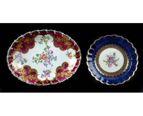 A Chelsea porcelain claret ground oval dish, c1760, painted with polychrome floral sprays and enriched with tooled gilding, t