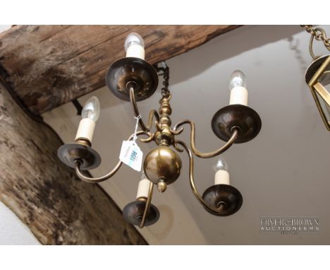A brass five-branch ceiling light, with candle style lights; a pair of brass three-branch drop ceiling lights, with candle ef
