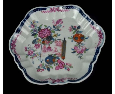 A Worcester porcelain teapot stand of barbed hexagonal form, painted with a chinoiserie scroll pattern with pomegranates and 