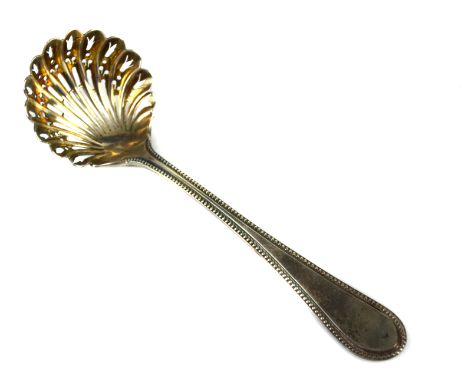 A Victorian silver sifter ladle, pierced shell form bowl with beaded handle, Sheffield 1872, makers mark RM over EH in quatre