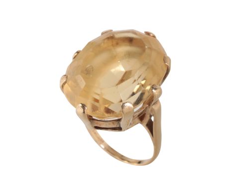 A CITRINE DRESS RING the oval-cut citrine 15mm x 21mm, on a 9ct gold shank, ring size K