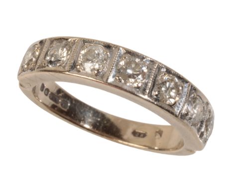 A  DIAMOND HALF ETERNITY RING seven brilliant-cut diamonds, square set in 18ct white gold, the shank hallmarked "750", approx