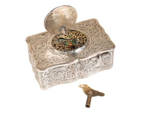 A  19TH CENTURY CONTINENTAL SILVER AUTOMATON  MUSICAL BIRD BOX the case decorated with engraved birds amongst foliage, the li