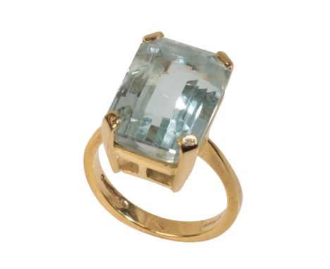 AN AQUAMARINE DRESS RING the aquamarine approx 17.3mm x 12.6mm, raised set on an 18ct yellow gold shank, with Birmingham hall