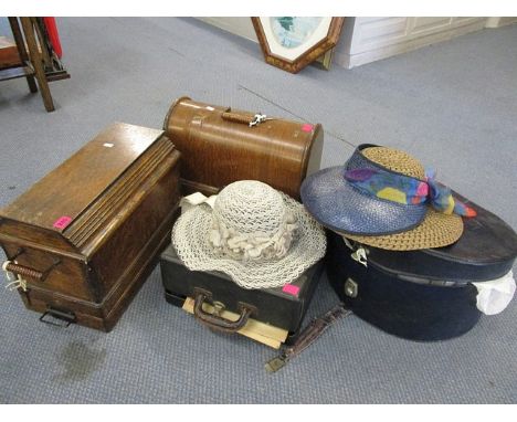 Two 1910 Singer sewing machines (serial numbers F5082391 and F182106), a vintage typewriter and an early 20th Century hat box