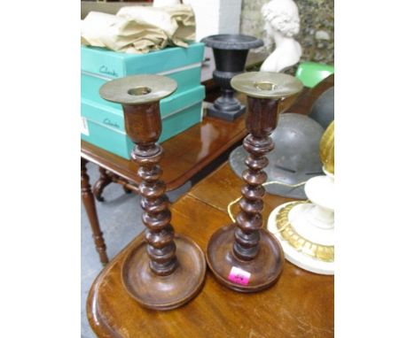 A pair of early 20th century bobbin turned mahogany candlesticks, 12 3/4 h