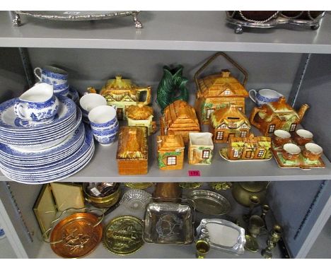 A ceramic lot to include cottage ware, blue and white Willow tableware's and a Devon ware Glug-Glug jug