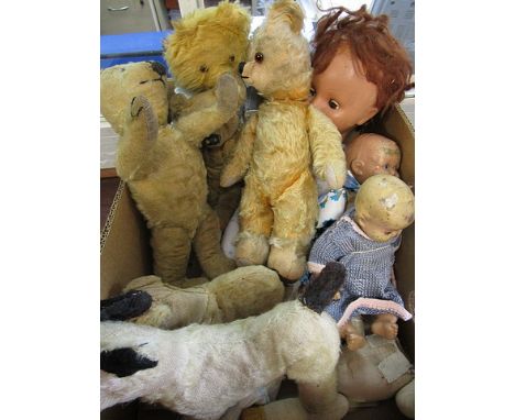 A group of vintage teddy bears, dolls, and a Merrythought dog
