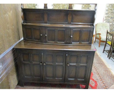 A mid 20th century Ercol elm sideboard having a raised back, 65 h x 57 1/4 w