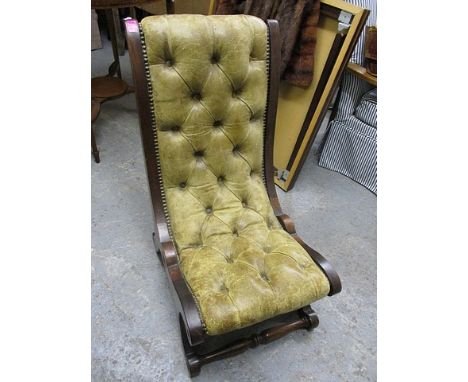 A modern mahogany leather, button upholstered slipper chair