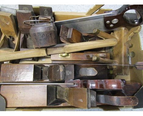 A selection of woodworking tools to include saws, planes and other items