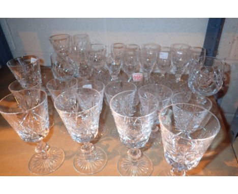 Shelf of mixed Stuart Crystal glasses 