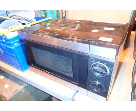 Kitchen microwave in black 700w  CONDITION REPORT: All electrical items in this lot have been PAT tested for safety and have 