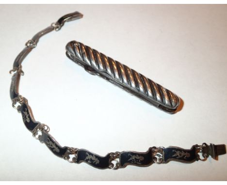 Hallmarked silver folding button hook (marks rubbed) and a Siam silver bracelet 