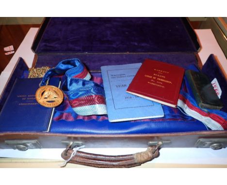 Masonic leather case containing apron collar sash and various books 
