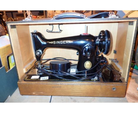 Cased electric Singer sewing machine serial no EH853193 CONDITION REPORT: All electrical items in this lot have been PAT test