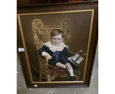 A framed portrait of a boy
