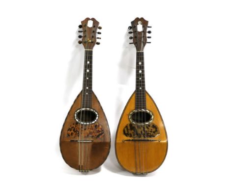 Two Italian Bowlback Mandolins, both with mother of pearl around sound holes and tortoise shell scratchplates, one labelled '