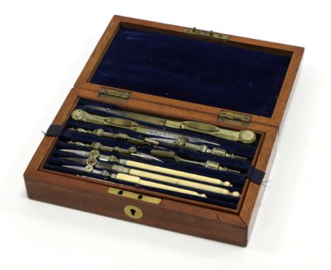 Set Of Drawing Instruments in mahogany case with lift out drawer; upper section contains compasses, dividers and pens, three 